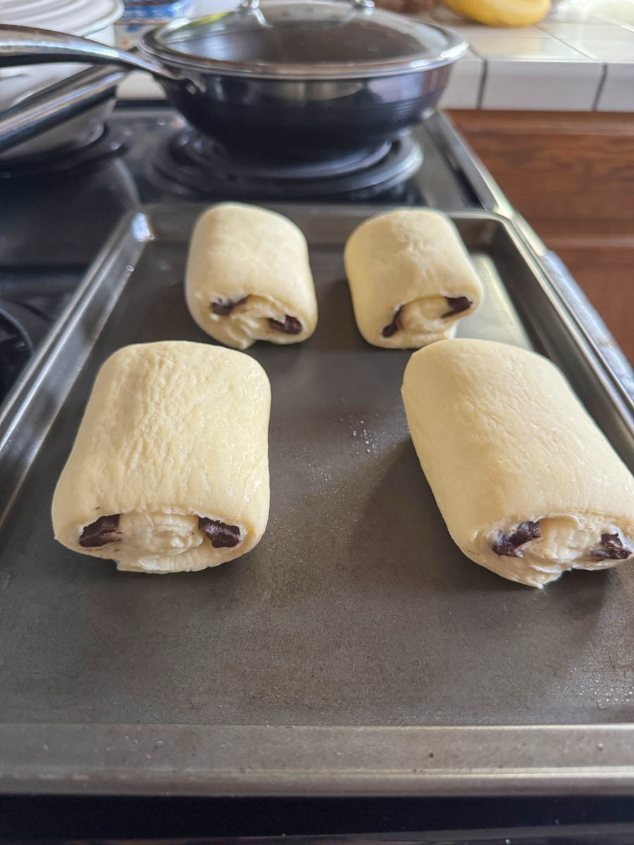 raw chocolate croissants on the baking dish