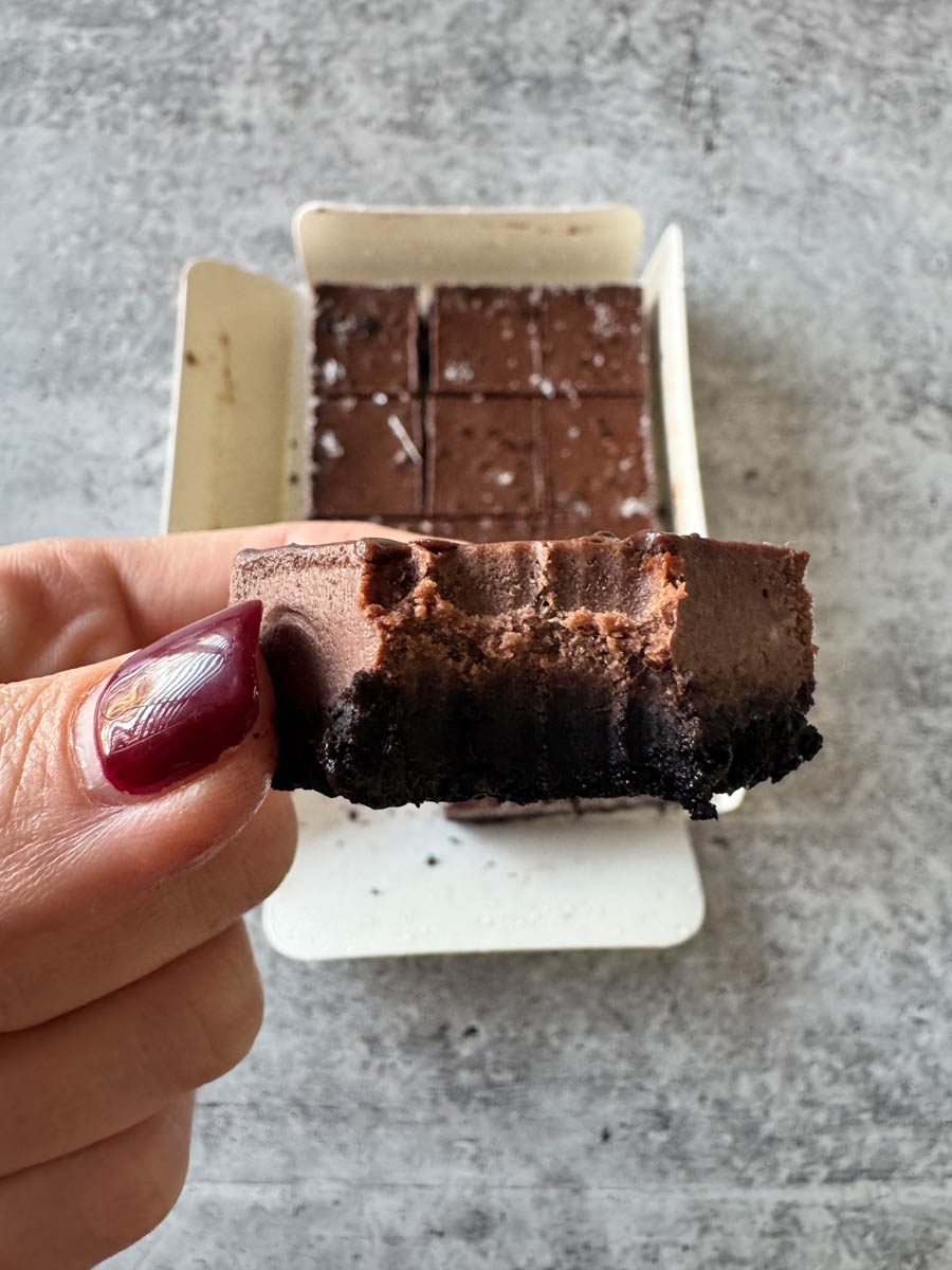 taking a bite from chocolate cheesecake