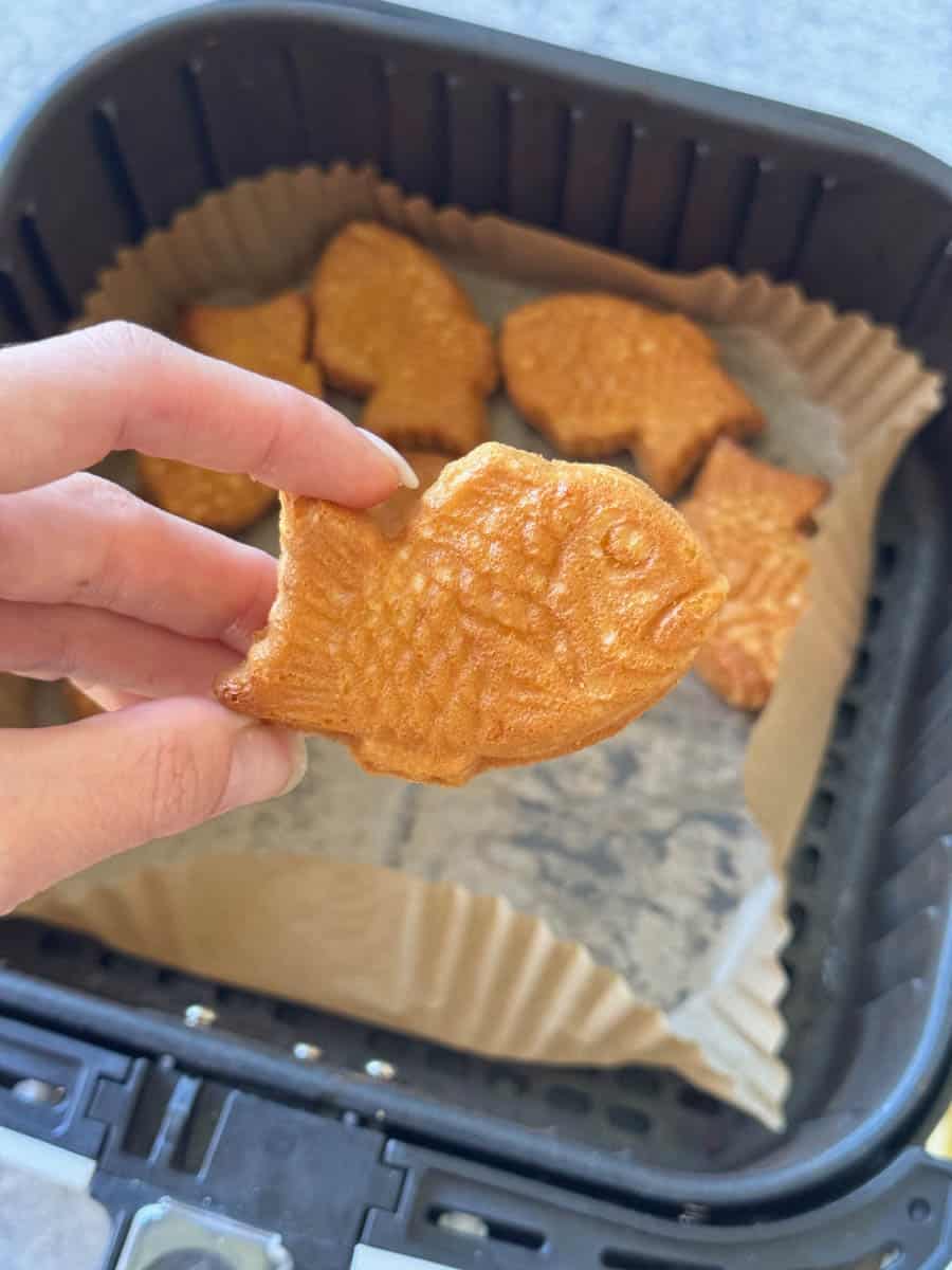 mini fish made out of dough in hand