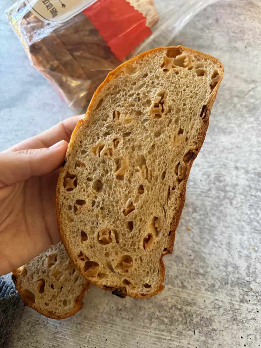 a piece of bread in hand