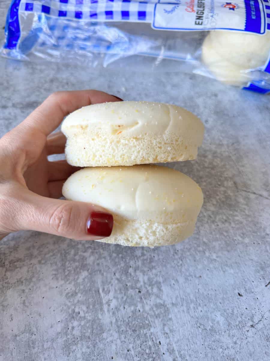 gluten free English muffins in hand