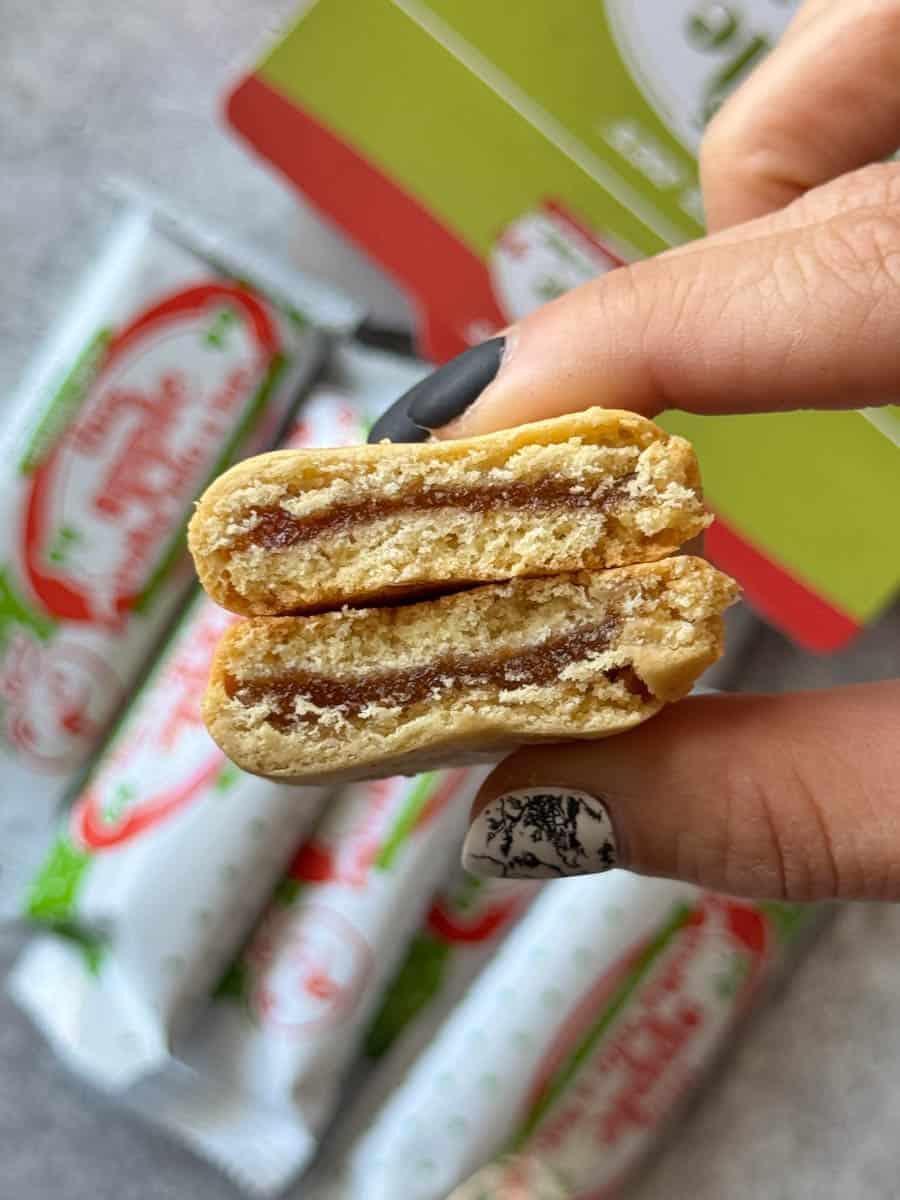 apple bar cut in half in hand