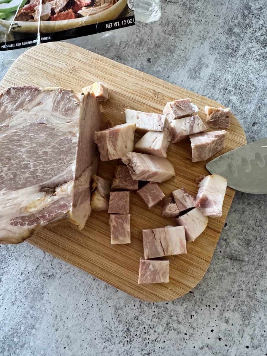 cubed cooked pork on the cutting board