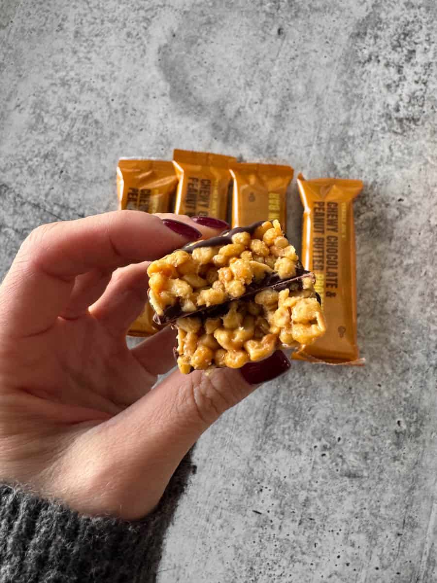 trader joe's chocolate and peanut butter bar in hand