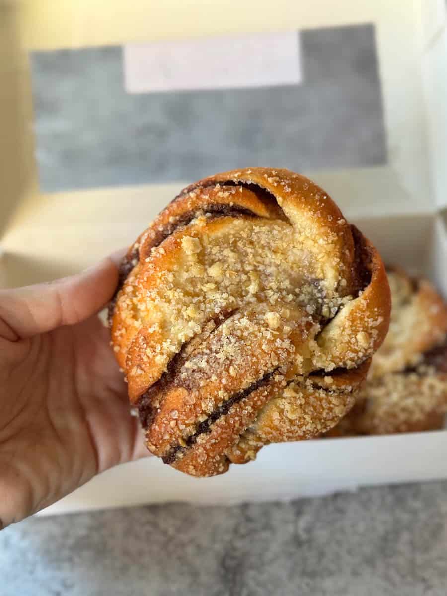 trader joe's apple cinnamon bun in hand