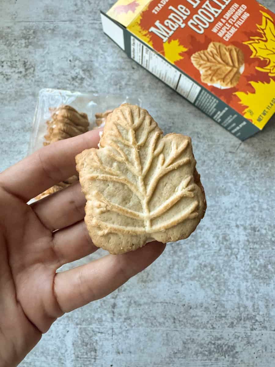 trader joe's maple leaf cookie in hand