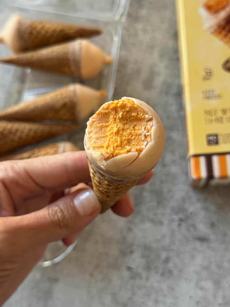 holding ice cream cone from trader joe's in hand