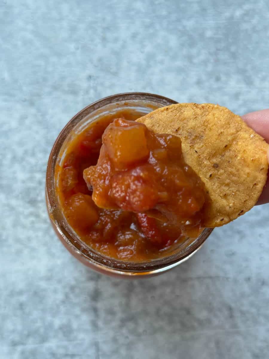 dipping a chip in salsa