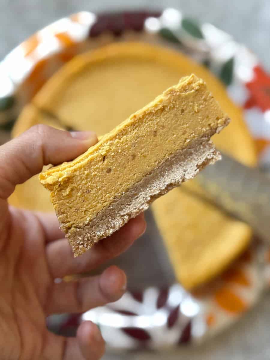 a piece of trader joe's pumpkin pie in hand