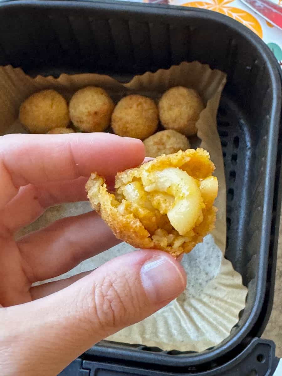 took a bite of a orange crispy ball