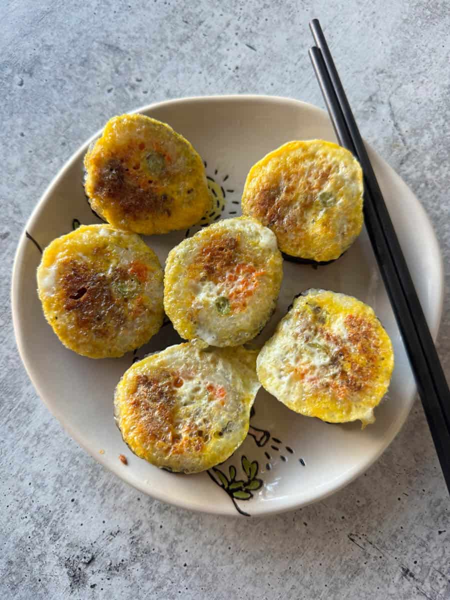 kimbap pieces cooked in egg on the plate