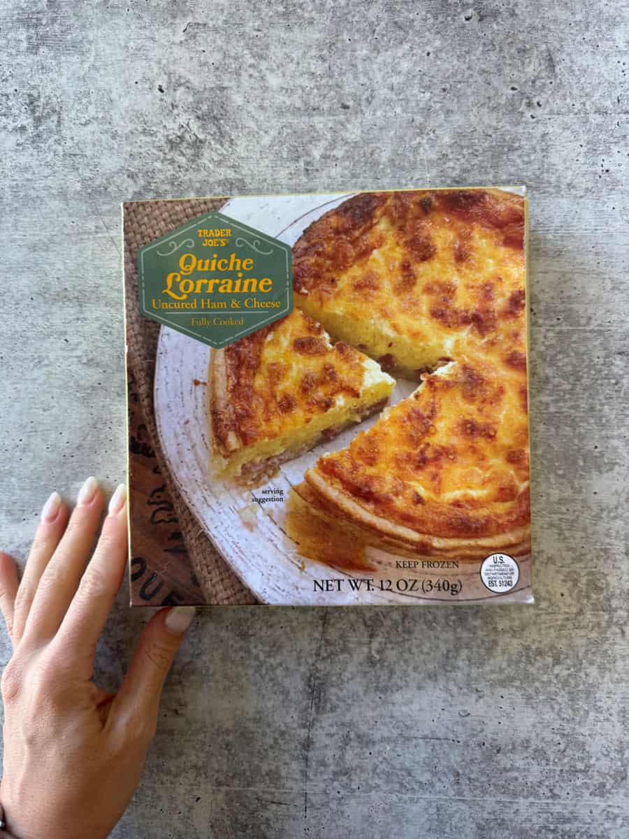 Frozen cheese and ham quiche with golden crust, ready to bake or serve.