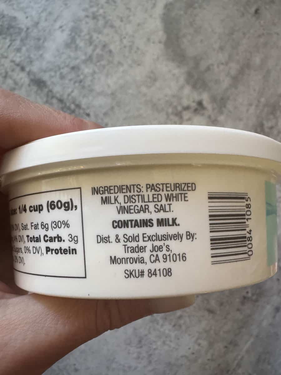 Cream cheese container with ingredients label.
