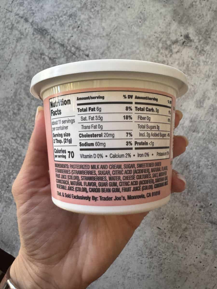 Close-up of Trader Eats yogurt cup with fruit topping, nutrition facts visible.